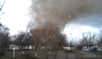 Frame of the tornado as it passes over the school complex. (Video by Rhett Adams)